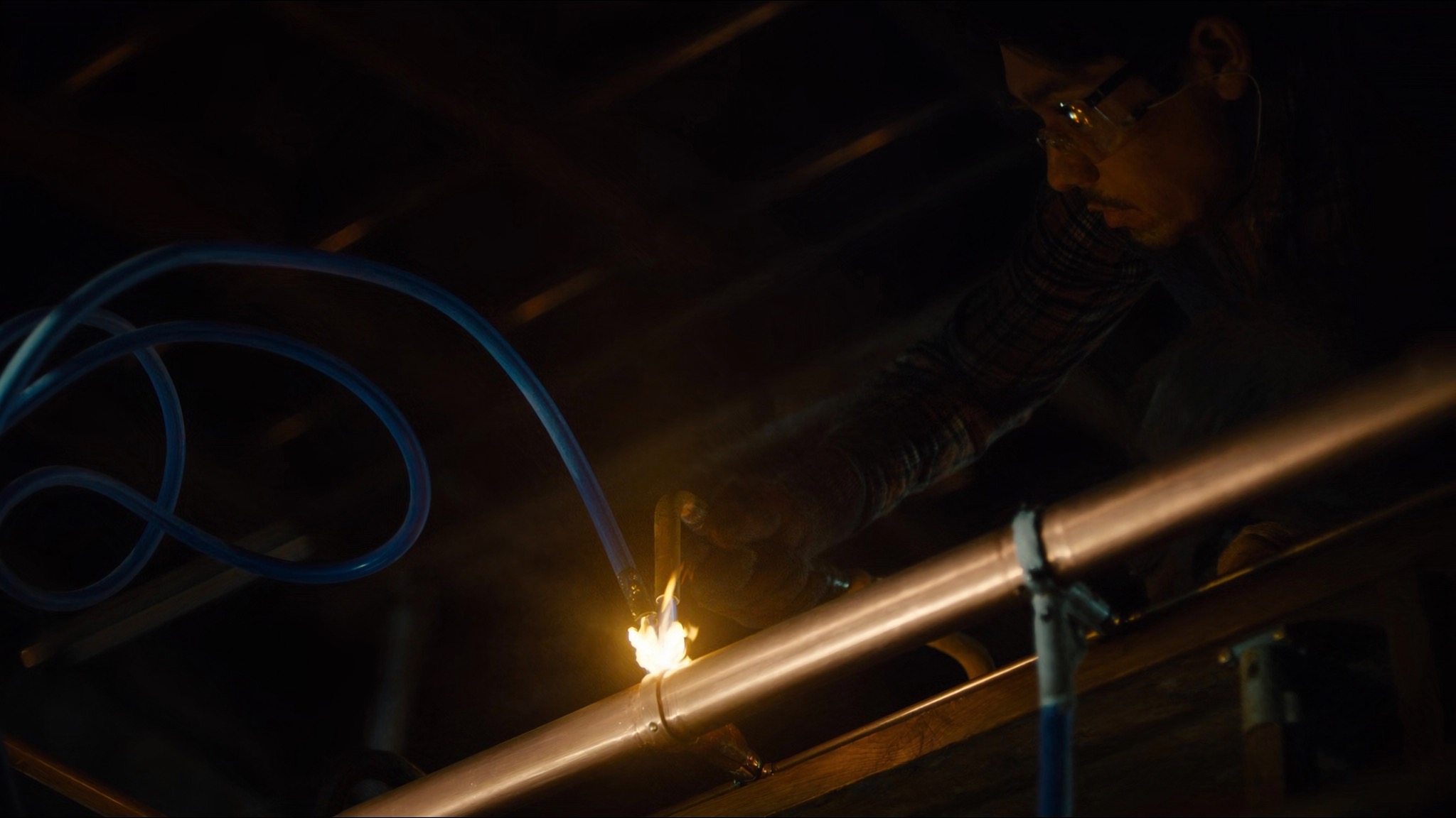Plumber soldering a copper gas line